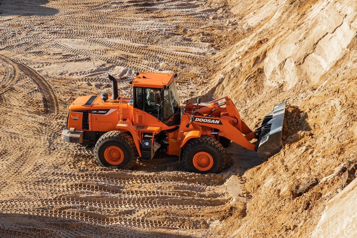 Wheel loader moving material in a quarry — Wheel loader rental in the UAE
